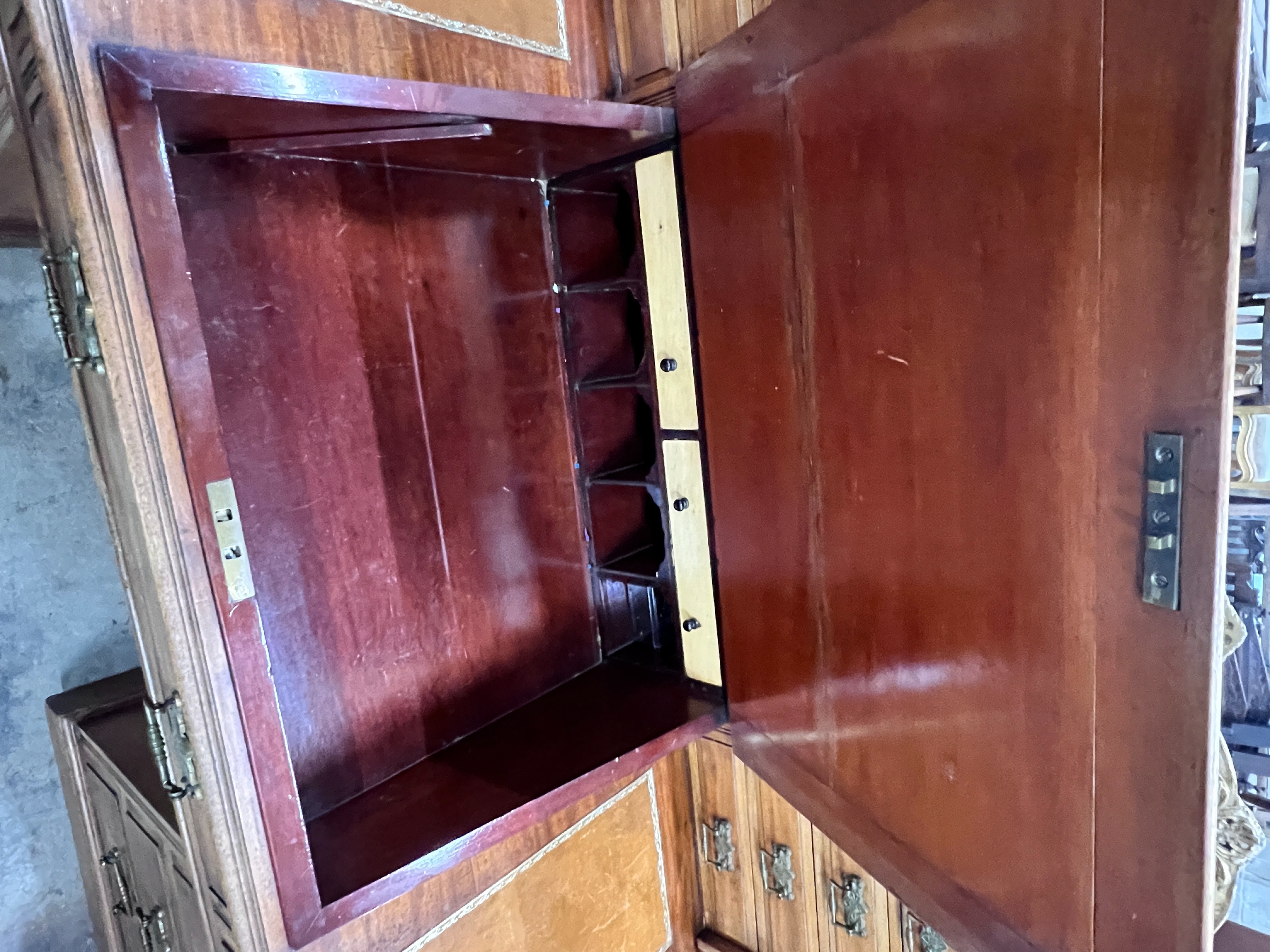 A late Victorian mahogany pedestal desk with hinged slant front, width 137cm, depth 73cm, height 113cm